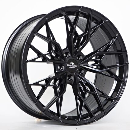 Black forged alloy wheel with an intricate multi-spoke design and central logo badge, on a white background.