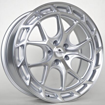 Silver alloy car wheel with an intricate multi-spoke design and a center cap that reads 'Forged Wheels'.
