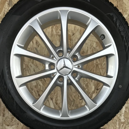 Mercedes alloy wheel with a silver multi-spoke design and center emblem