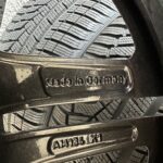Close-up of tire tread with an embossed 'Made in Germany' mark visible on the wheel area.