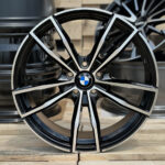 Close-up of a black and silver BMW alloy wheel with the BMW emblem at the center.