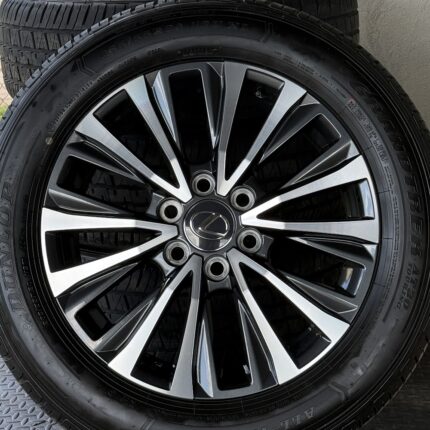 Close-up of an alloy wheel with a Lexus center cap and a black tire