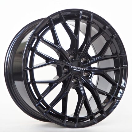 Black glossy alloy wheel with a complex multi-spoke design, centered by a small hub cap